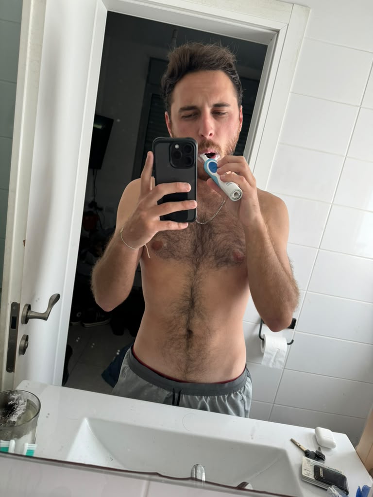 Leead photographed in a bathroom mirror in February 2025, before the year of training these modules came out of.