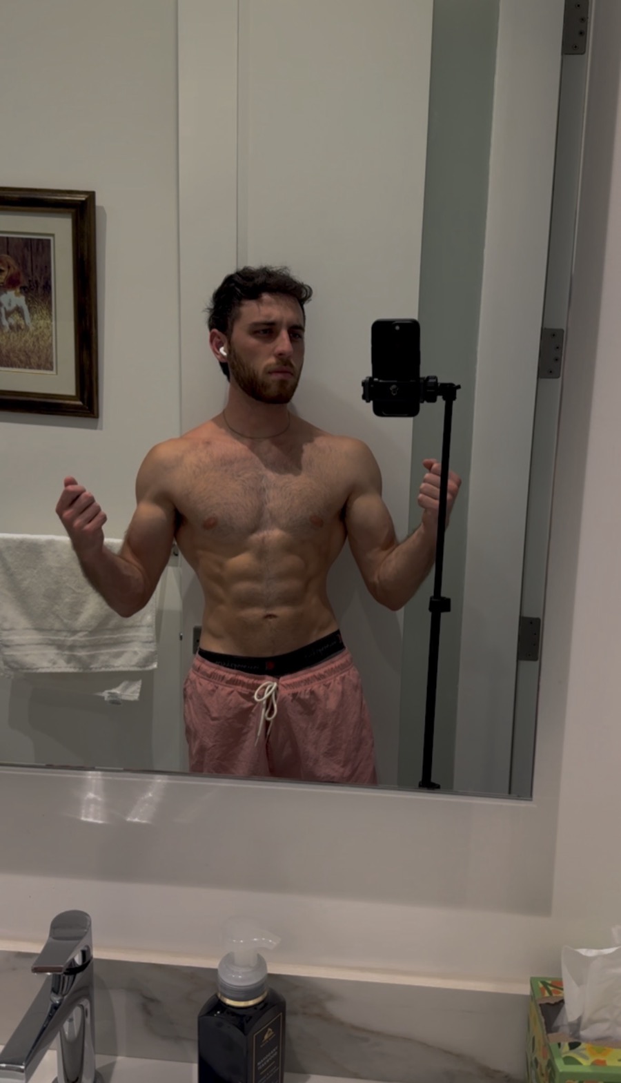 Leead photographed in a bathroom mirror.